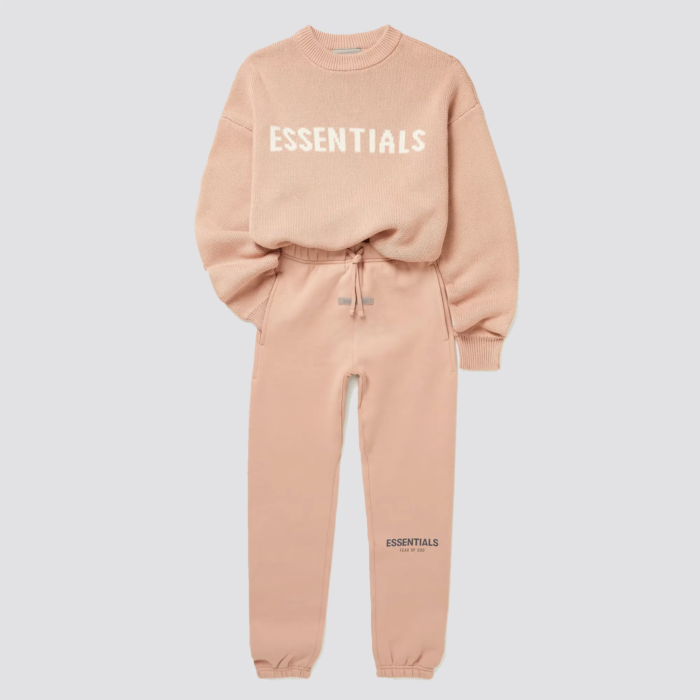 The Fear of God Essentials Kids Tracksuit in pink is a stylish and comfortable tracksuit set for children. It is made by Fear of God, a luxury fashion brand known for its street-inspired and casual designs. The tracksuit is made of a comfortable and durable fabric, and comes in a pink color. The set includes a full-zip hoodie and pants with ribbed cuffs and hem for a snug fit. The tracksuit often features the brand's logo on the chest. The pink color gives it a playful and unique look, perfect for any child that loves to stand out with their clothing.
