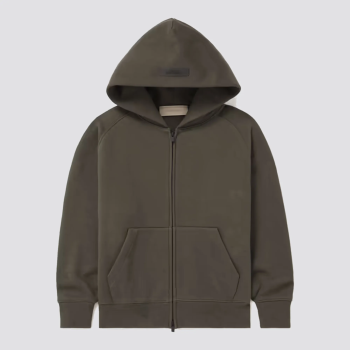 The Fear of God Essentials Kids Tracksuit Zip-up Hoodie is a stylish and comfortable hoodie for children, part of a tracksuit set. It is made by Fear of God, a luxury fashion brand known for its street-inspired and casual designs. The hoodie features a full-zip front design, a hood with drawstring, and ribbed cuffs and hem for a snug fit. The hoodie is usually made of soft and comfortable cotton material and comes in a variety of colors. It's perfect for everyday wear and can be paired with the matching track pants to complete the tracksuit look.